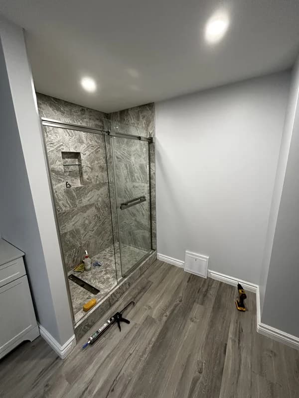Modern bathroom renovation in St. Thomas Ontario on Forest Ave with tiled shower and new finishes
