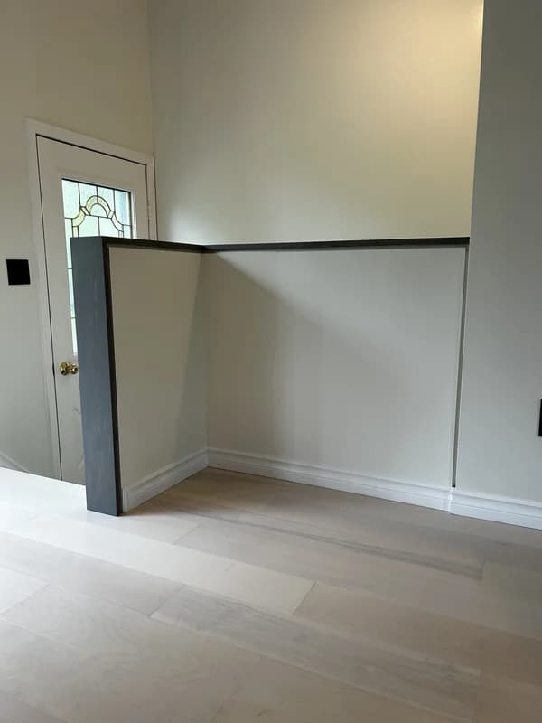 Basement staircase renovation in Dorchester Ontario with vinyl steps, drywall railing and Trim-Tex profiles